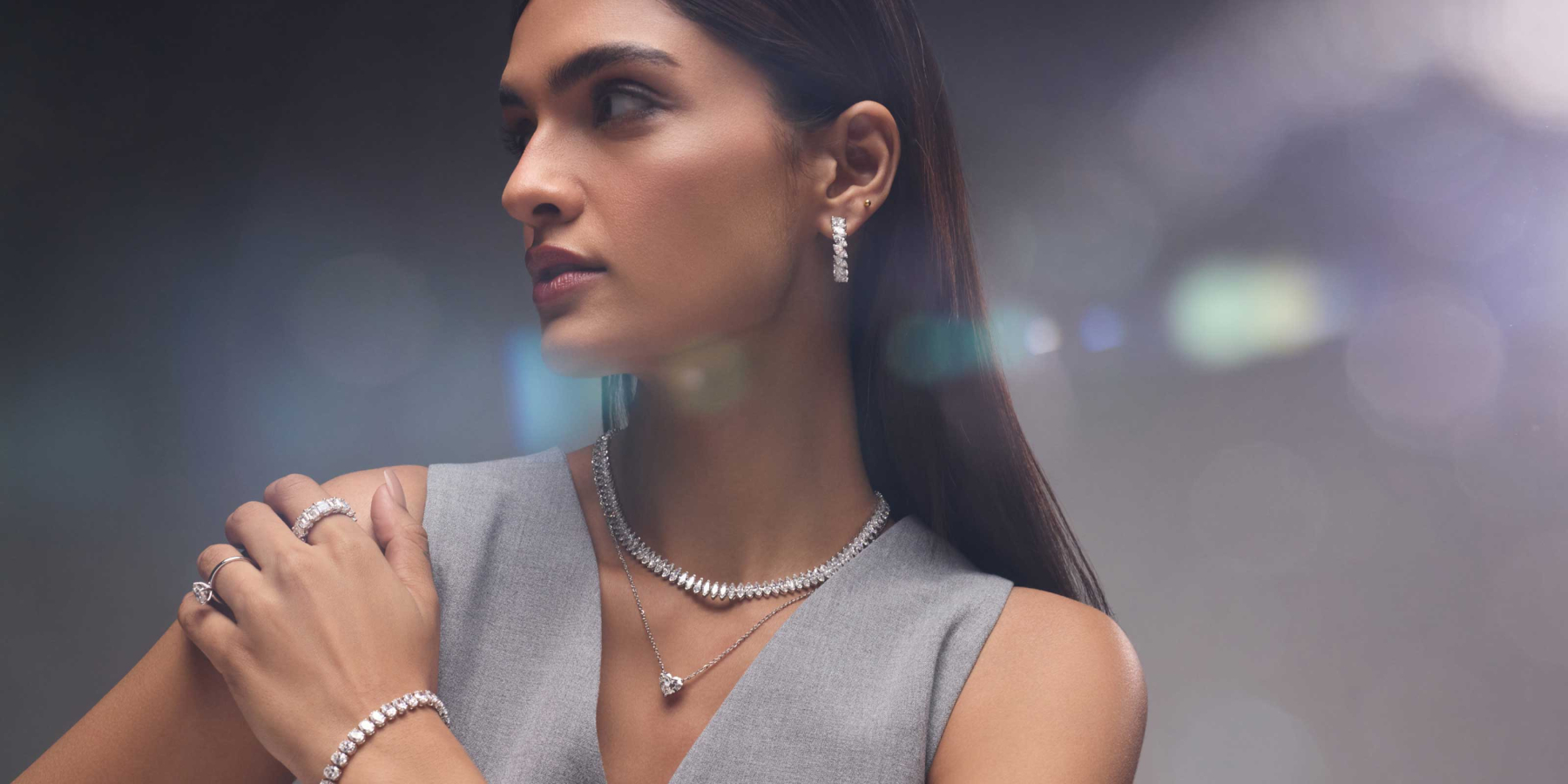 A woman wearing lab-grown diamond jewellery